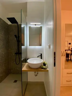 a bathroom with a sink and a glass shower at ZEN Residence 1 in Athens