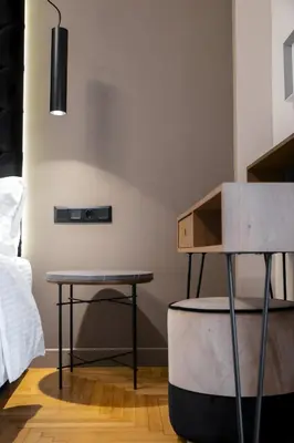 a room with two tables and a bed at Acropolis Prime Stay in Athens