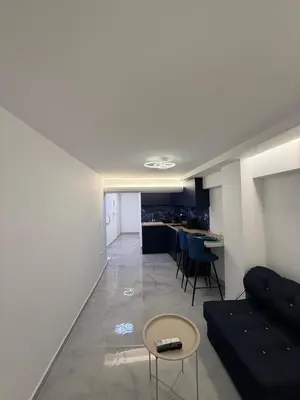 a living room with a couch and a table at City Center Dream Studio in Athens
