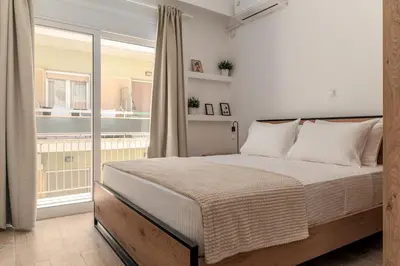 a bedroom with a bed and a balcony at Athens Urban Vibes 3 Bright Front Apt Sunny in Athens