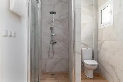 a shower stall in a bathroom with a toilet at Athens Urban Vibes 3 Bright Front Apt Sunny in Athens