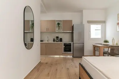 a kitchen with a bed and a mirror in a room at Athens Urban Vibes 4 Quiet Balcony Peaceful in Athens