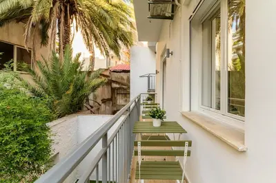 a stairway leading to a balcony with palm trees at Athens Urban Vibes 4 Quiet Balcony Peaceful in Athens