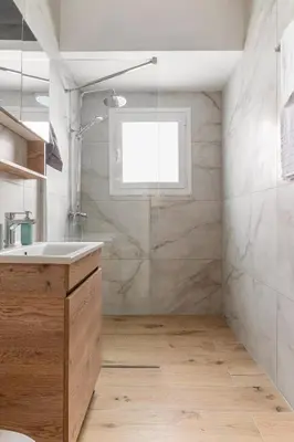 a bathroom with a shower and a sink and a window at Athens Urban Vibes 4 Quiet Balcony Peaceful in Athens