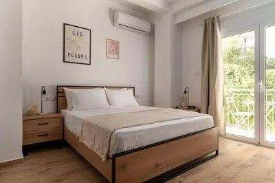 a bedroom with a large bed and a window at Athens Urban Vibes 5 Cozy Balcony Renovated in Athens