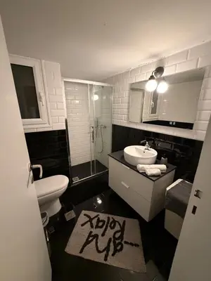a bathroom with a toilet and a sink and a shower at Athens central apartment in Athens