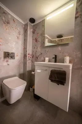 a bathroom with a toilet and a sink and a mirror at Smart Studio with Self Check-in in Athens