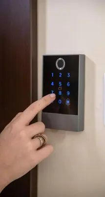 a person with their index finger pointing to a lightswitch at Smart Studio with Self Check-in in Athens