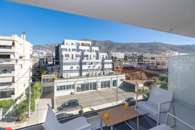 a view of a city from the balcony of a building at M58 Pool Residence - Glyfada Central - Miltiadou 58 by K&M in Athens