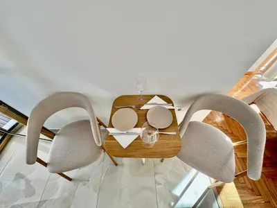 a dining table with chairs and a tableweredotentotent at Rooftop Oasis - Design Studio with Acropolis View in Athens