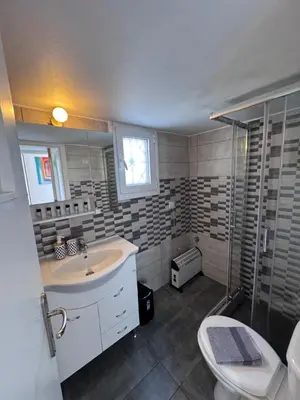 a bathroom with a sink and a shower and a toilet at Krezias Apartments K1 Acropolis View ! in Athens