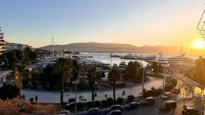 a view of a harbor with boats in a marina at Promenade Piraeus in Piraeus