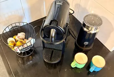a kitchen counter with a blender and a basket of food at Promenade Piraeus in Piraeus
