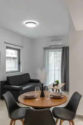 a living room with a table and a couch at M20 Athens Apartments in Athens