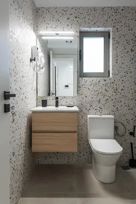 a bathroom with a toilet and a sink and a mirror at M20 Athens Apartments in Athens
