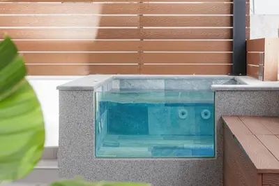 a swimming pool in the middle of a house at Elysium Heated Jacuzzi with Acropolis View in Athens
