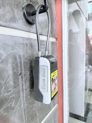 a padlock hanging on a door with a window at Elysium Heated Jacuzzi with Acropolis View in Athens
