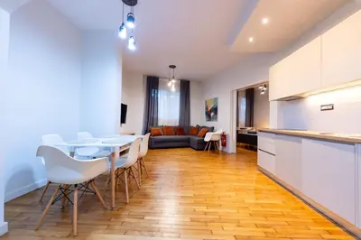 a kitchen and living room with a table and chairs at HeKo Collection Athens Center 1 in Athens