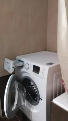 a washer and dryer in a room at Eleni's apartment in Piraeus