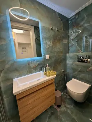 a bathroom with a sink and a toilet at City Center Green Lux Studio in Athens