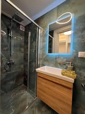 a bathroom with a sink and a shower at City Center Green Lux Studio in Athens