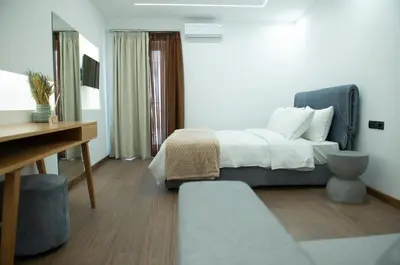 a hotel room with a bed and a desk at Klitiou 7 Boutique Hotel in Athens