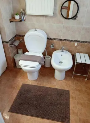 a bathroom with a toilet and a sink at Triple Nest Maisonette - Korydallos by ΜΡS in Piraeus
