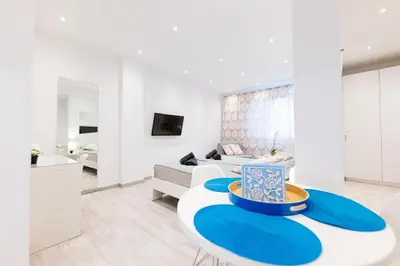 a living room with a couch and a table at HeKo Collection Athens 2 in Athens