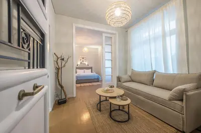 a living room with a couch and a table at Zen Style, Exarchia in Athens