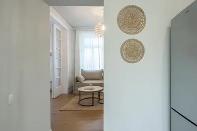 a living room with a couch and a table at Zen Style, Exarchia in Athens