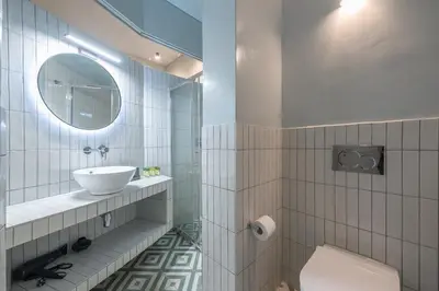 a bathroom with a sink and a mirror at Zen Style, Exarchia in Athens
