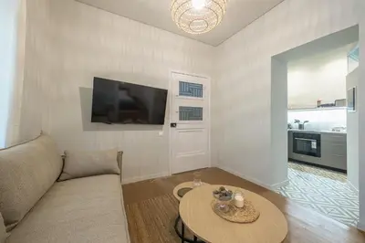 a living room with a couch and a table at Zen Style, Exarchia in Athens