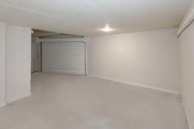 an empty room with a garage with a door at Dream House Voula in Athens