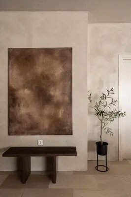 a table in a room with a painting on the wall at ATELIER 57 , Stunning Acropolis View Monastiraki Apartment in Athens
