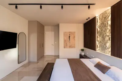 a bedroom with a large bed and large windows at ATELIER 57 , Stunning Acropolis View Monastiraki Apartment in Athens