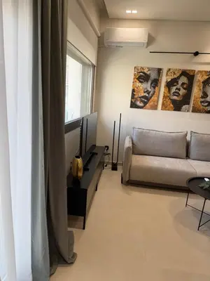 a living room with a couch and a tv at Plaza Luxury Suite, 2' from Metro, 5' from Piraeus in Piraeus