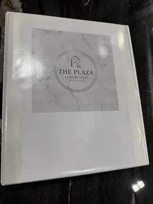 a white plate with a label on a table at Plaza Luxury Suite, 2' from Metro, 5' from Piraeus in Piraeus