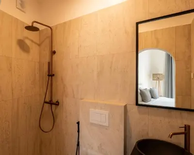 a bathroom with a sink and a mirror at CALM South 19 in Athens