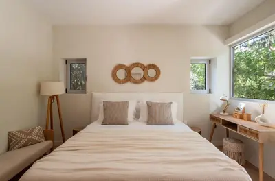 a bedroom with a large bed and a window at CALM South 19 in Athens