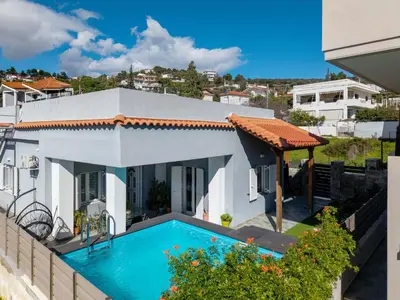 a view of a house with a swimming pool at Porto Blue Heaven in Porto Rafti