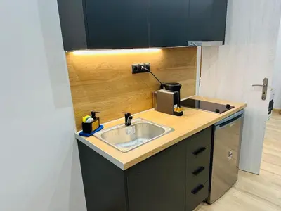 a kitchen with a sink and a counter top at Agatha-4 in Piraeus