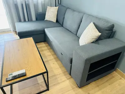 a living room with a couch and a coffee table at Agatha-4 in Piraeus