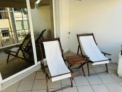 two chairs sitting on top of a balcony at Agatha-4 in Piraeus