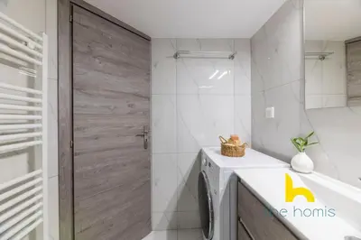 a bathroom with a shower and a washing machine at Sun Splashed Sanctum w Green Patio, Acropolis in Athens