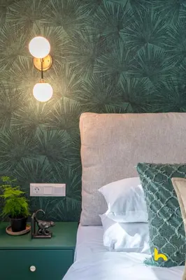 a bedroom with a bed with a green wall at The Urban Jungle Escape Corner APT Near Acropolis in Athens