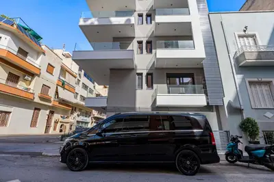 a black van parked in front of a building at Athens Vein in Athens