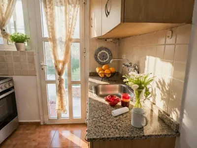 a kitchen counter with a sink and a window at Zwgrafou Deluxe For 4 Pers in Athens