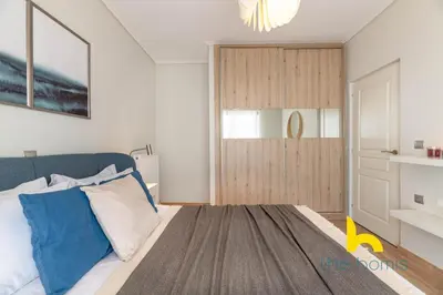 a bedroom with a bed and a sliding door at Sunny Athenian Oasis Spacious Family Haven! in Athens