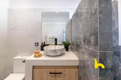 a bathroom with a sink and a mirror at Sunny Athenian Oasis Spacious Family Haven! in Athens