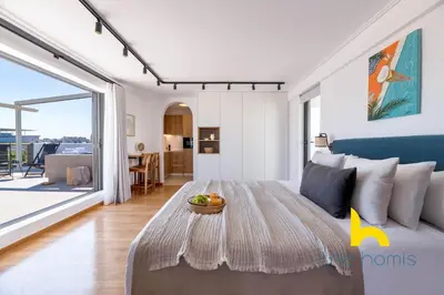 a living room with a couch and a table at Eagle's Nest Athens Oasis with Culture & Views! in Athens